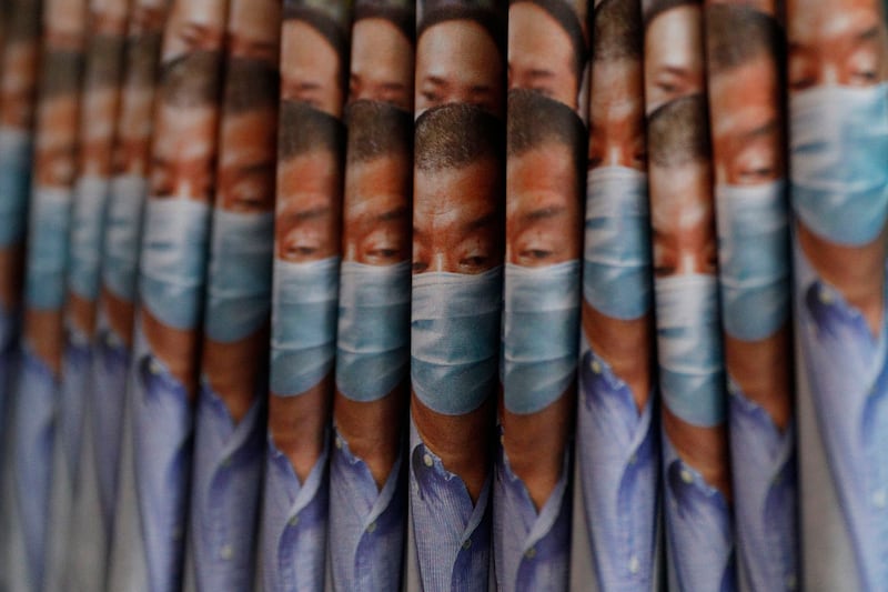 Copies of the Apple Daily newspaper, featuring Hong Kong media tycoon Jimmy Lai, are displayed at a newsstand in Hong Kong, Aug. 11, 2020. Credit: Kin Cheung/AP