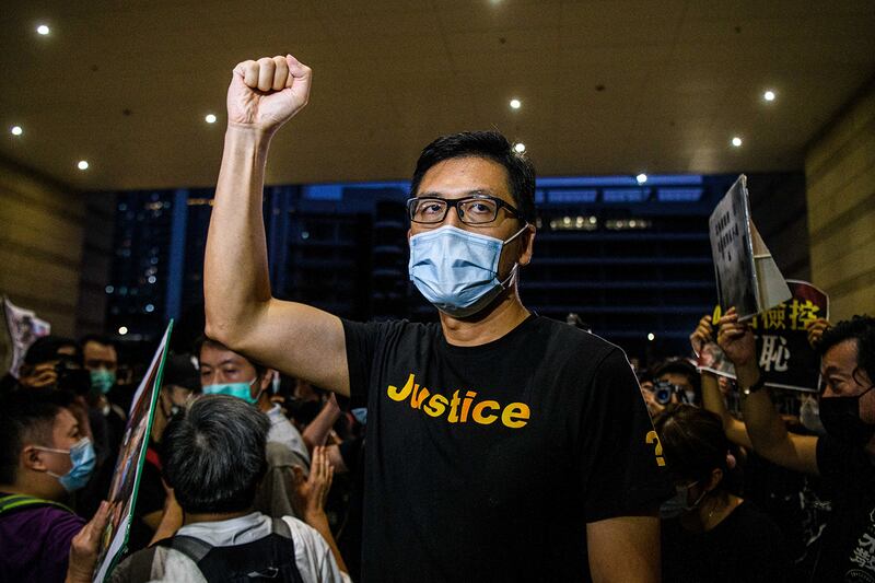 Pro-democracy lawmaker Lam Cheuk-ting gestures outside of Hong Kong's West Kowloon Magistrates Court on Aug. 27, 2020.