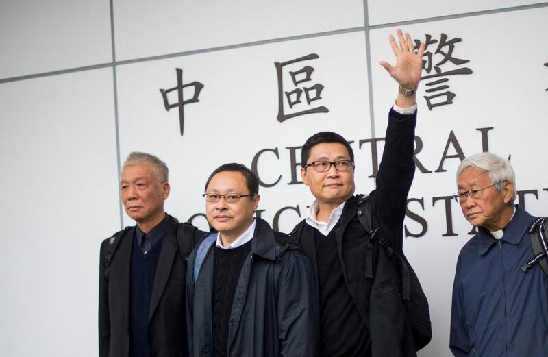 (L-R) Chu Yiu-ming, Benny Tai, original founder of the pro-democracy Occupy movement, Chan Kin-man and Chinese Cardinal of the Catholic Church and former bishop of Hong Kong, Joseph Zen, come out of the police station in Hong Kong on Dec. 3, 2014. (Johannes Eisele/AFP)