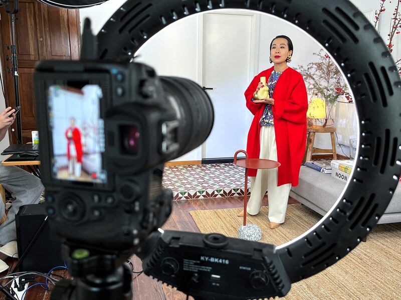 nfluencer Tera Feng prepares to host a livestream sales session on the social media platform Xiaohongshu, at her apartment in Shanghai, China, Dec. 16, 2024.