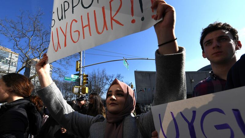 People protest at a Uyghur rally in front of the US Mission to the United Nations in New York, Feb. 5, 2019.