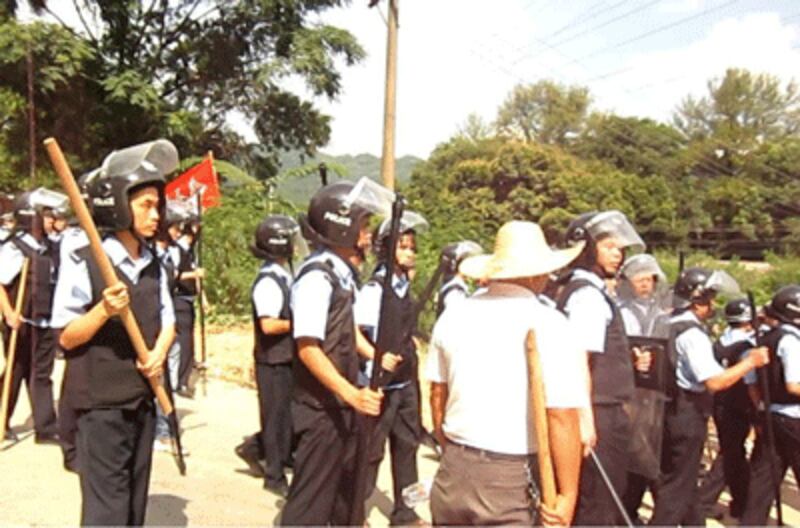 Chinese police gear up to take on villagers opposed to the mining project. Photo by RFA