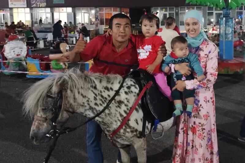 Kazakhstan national Zhenis Kanat\with his wife and two children, before his trip to China, Feb. 2025.