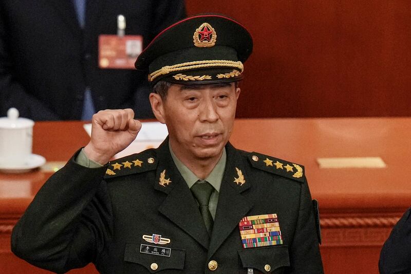 Chinese Defense Minister Gen. Li Shangfu takes his oath during a session of China's National People's Congress in Beijing on March 12, 2023. Credit: Andy Wong/AP