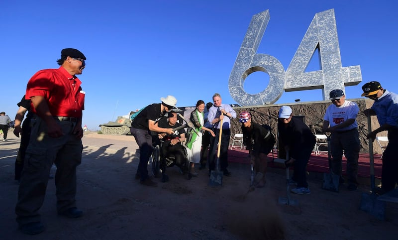 Rep. Chris Smith (C) and Tiananmen protest veteran Fang Zheng (2nd L) are observed by sculptor Chen Weiming (L) at a ceremony on the 32nd anniversary of the 1989 Tiananmen Square massacre in Beijing, at Liberty Sculpture Park in Yermo, California, June 4, 2021. Credit: AFP