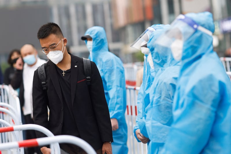 A resident of Beijing queues up for nucleic acid testing, April 25, 2022. Credit: Reuters