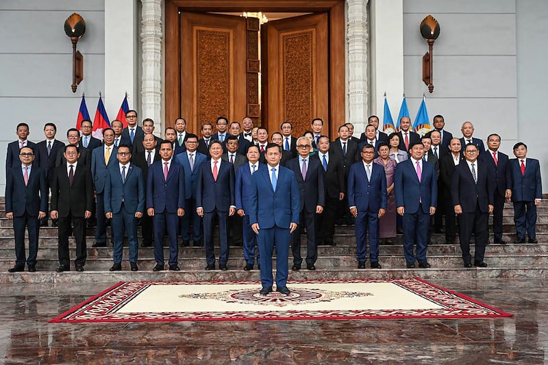 Cambodia's Prime Minister-designate Hun Manet, center, and incoming cabinet members pose for a group photo at the headquarters of the Cambodian People's Party in Phnom Penh, Aug. 10, 2023. (Kok Ky/Cambodia's Government Cabinet via AFP)