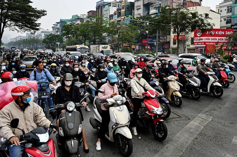 Vehicles wait at a red light at an intersection in Hanoi on January 8, 2025.