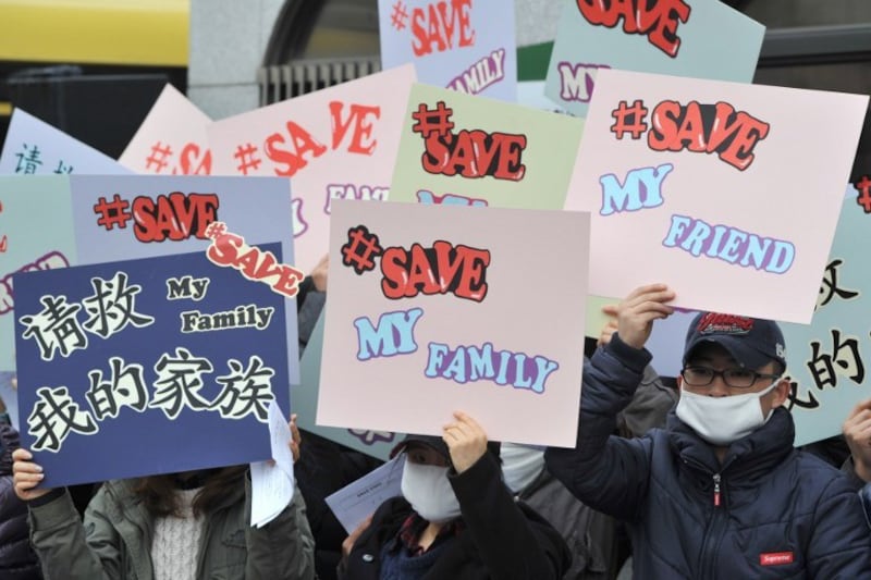 Young North Korean defectors hold placards denouncing China's policy of repatriating refugees from their country at a protest outside Beijing's embassy in Seoul in this file photo. Credit: AFP