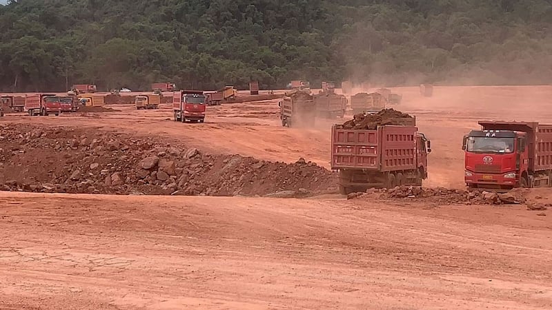 Trucks move earth at the Boten Special Economic Zone, located near Laos' main international border checkpoint with China at Mohan, Yunnan province, June 2019.