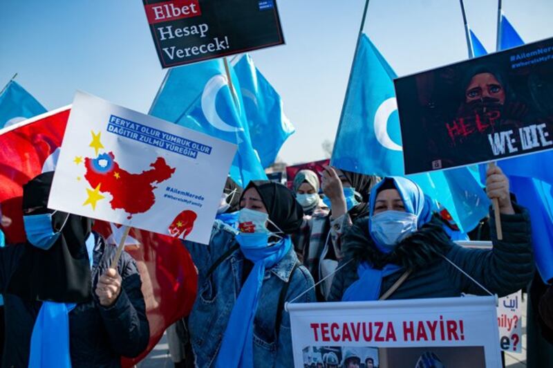 Uyghurs demand news about their relatives and express concern about the ratification of an extradition treaty between China and Turkey, during a demonstration in Istanbul, Feb. 26, 2021. (Yasin Akgul/AFP)