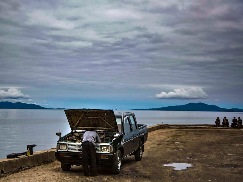 A man works on  his car in Chongjin City, North Korea in this undate photo.