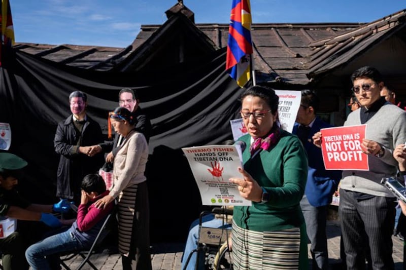 Tibetan exiles demonstrate against the U.S.-based company Thermo Fisher Scientific, in Dharamshala, India, Feb. 3, 2023. Protesters alleged that the Chinese police use equipment provided by the company for surveillance and to build a DNA database of Tibetans, Uyghurs and other minorities in China. Credit: Associated Press