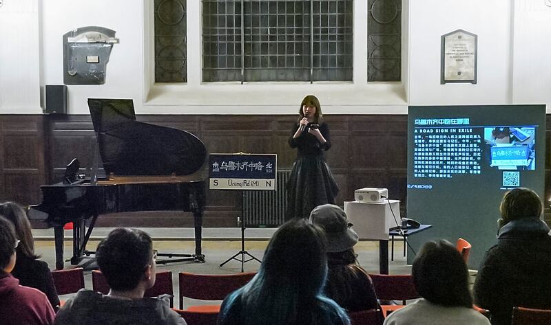 A speaker addresses the gathering at St Mary-At-Hill church in Billingsgate, London, marking the second anniversary of the fatal lockdown fire in Urumqi in China’s Xinjiang region, Nov. 23, 2024.