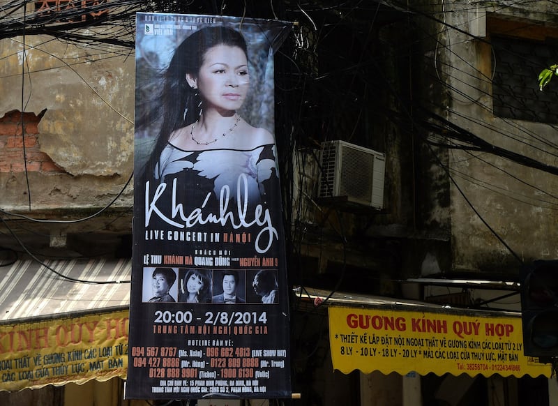 This picture taken on July 28, 2014 shows a poster featuring an upcoming live performance by well-known exiled Vietnamese singer Khanh Ly in downtown Hanoi. Credit: AFP