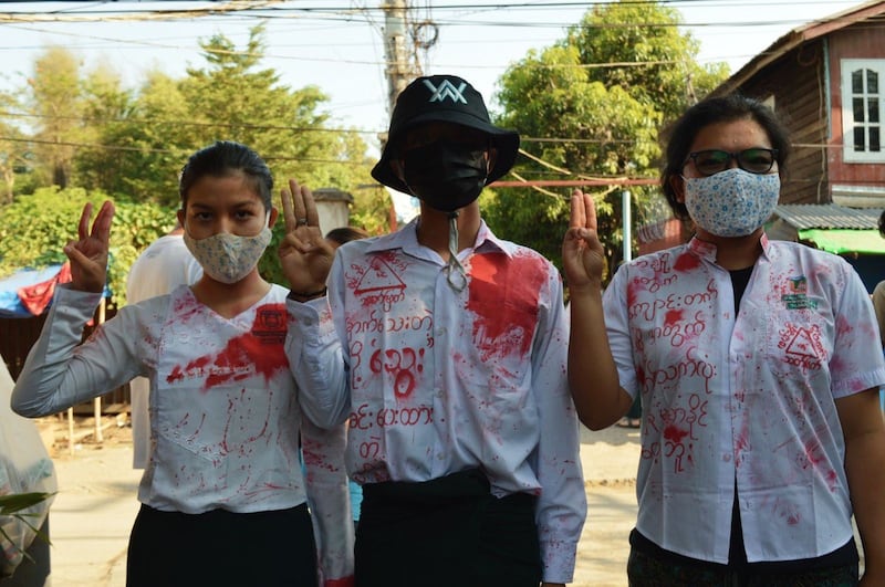 Anti-school reopening protest with red paint in Insein, Yangon.jpeg