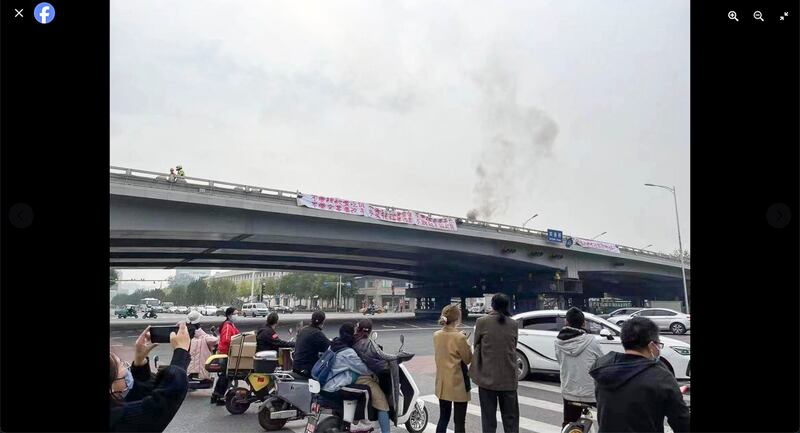 Two protest banners off Beijing's Sitong Bridge, Oct. 13, 2022. (Boycott Made In China via Facebook)