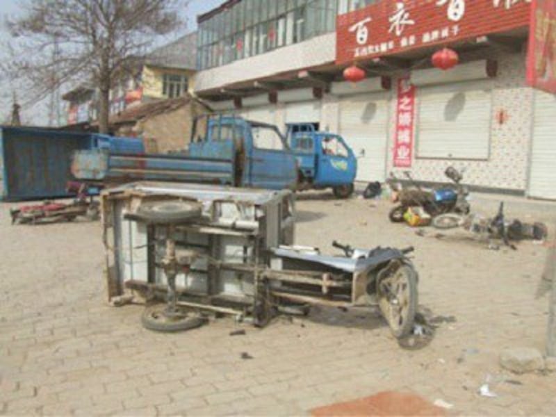 Vehicles that were turned over amid the rioting in Tianzhuang, March 31, 2012, in a photo obtained from a local resident.