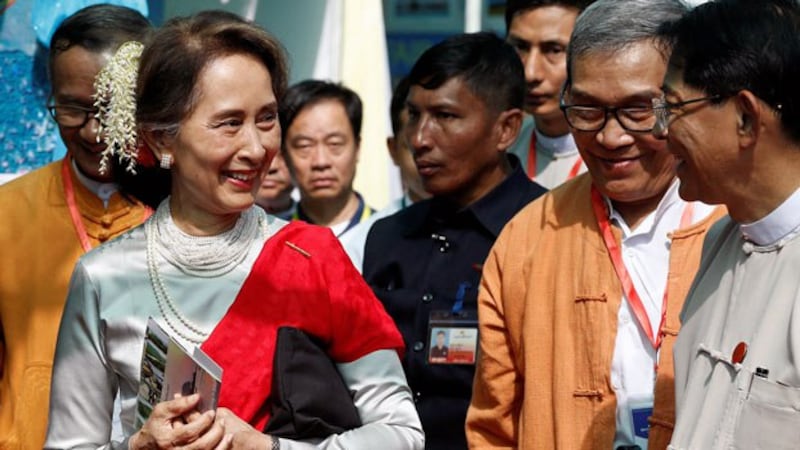 Myanmar's State Counselor Aung San Suu Kyi arrives at the Rakhine State Investment Fair at Ngapali beach in Thandwe, western Myanmar's Rakhine state, Feb. 22, 2019.