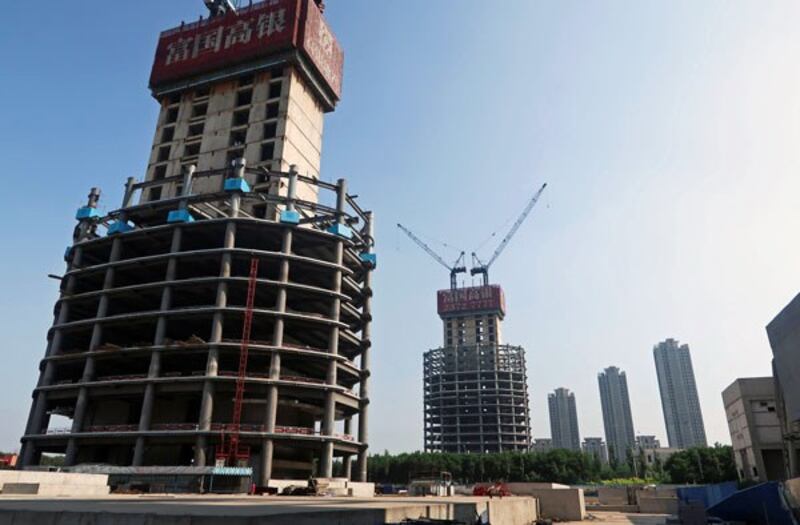 A construction site surrounding the Goldin Finance 117 skyscraper lies dormant in the high-tech zone of the coastal metropolis Tianjin in northern China, May 25, 2018.