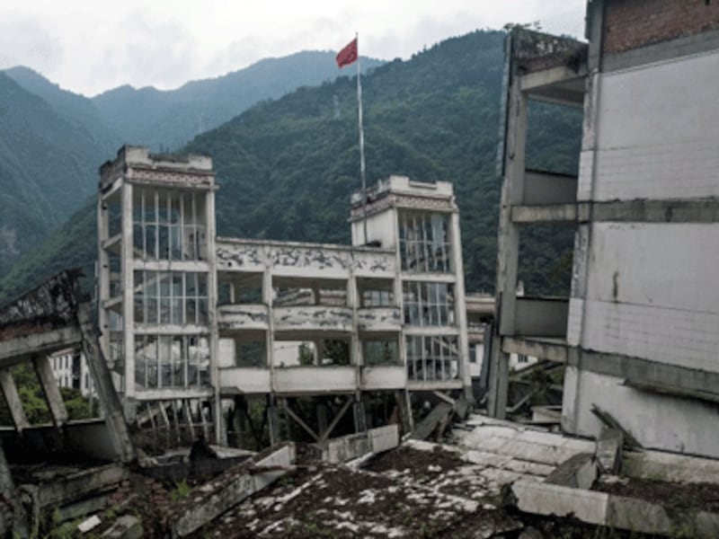 Part of the destroyed Xuankou Middle School is now the memorial site for the 2008 Sichuan earthquake in the town of Yingxiu, Wenchuan county, southwestern China's Sichuan province, April 21, 2018.