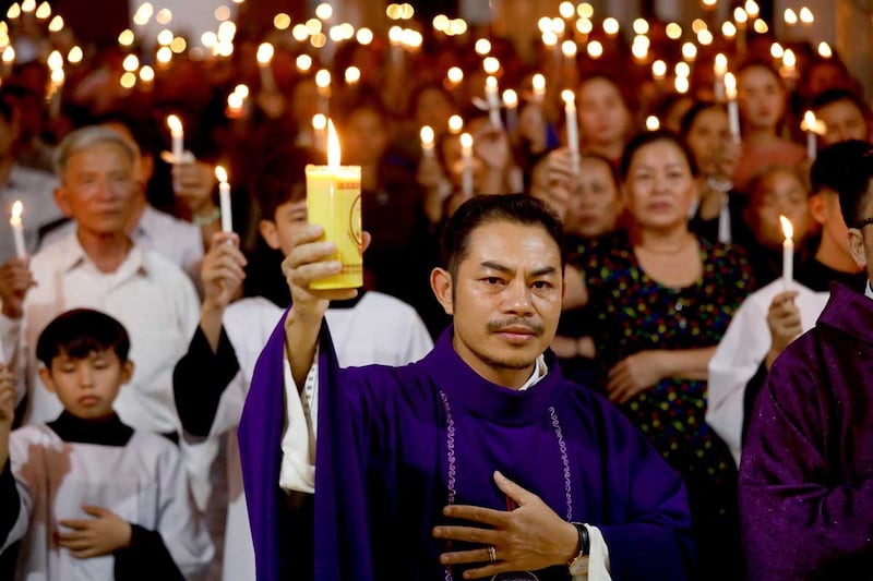 Catholic priest Anthony Luong holds a mass prayer for the lorry victims at a church in Nghe An on Nov. 30, 2019. (Reuters)