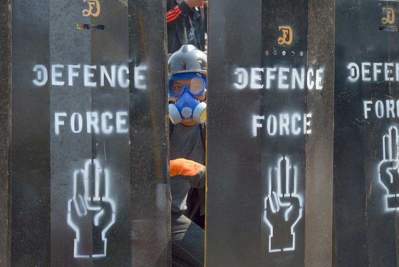 Homemade shields begin to appear on the streets of Myanmar as protesters seek to fend off rubber bullets, flashbang grenades and more. (Associated Press)