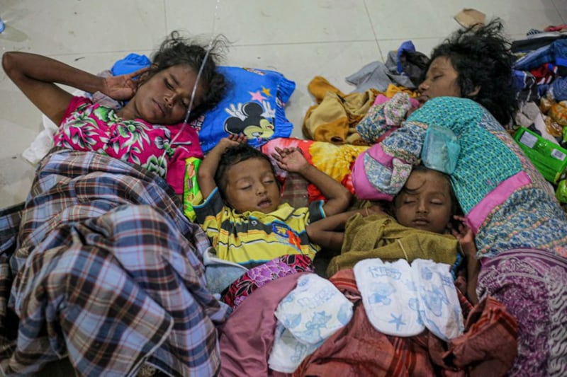 Rohingya refugees take a nap upon their arrival at a temporary shelter at the Ujong Pi village in Muara Tiga sub-district of Pidie, Aceh Province on December 26, 2022. Credit: AFP