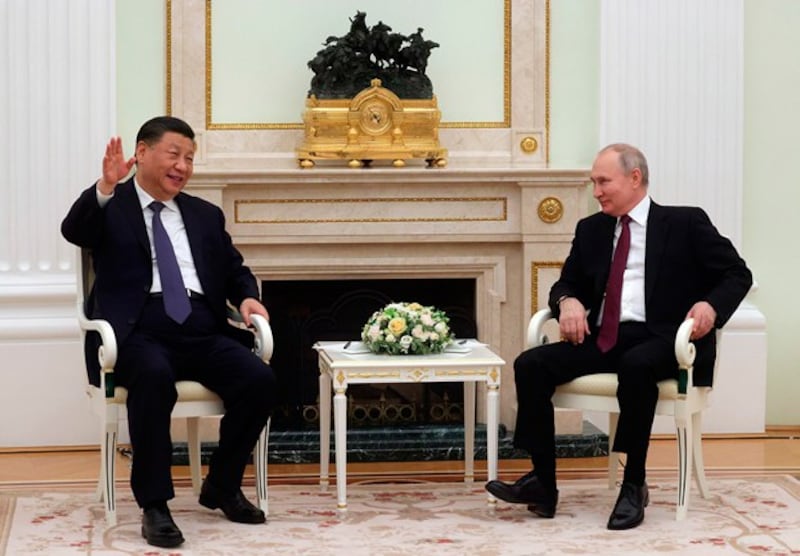 Chinese President Xi Jinping (L) gestures while speaking to Russian President Vladimir Putin during a meeting at the Kremlin in Moscow, March 20, 2023. (Sergei Karpukhin/SputnikKremlin pool photo via AP)