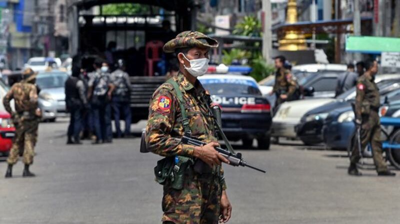 Junta soldiers patrol Yangon, May 7, 2021. AFP