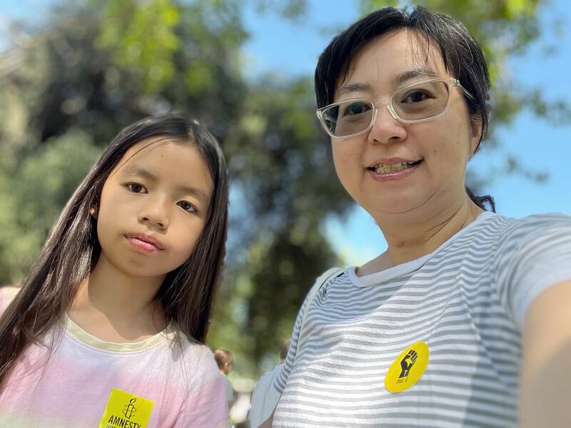 Chen Guiqiu, right, wife of rights lawyer Xie Yang, and the couple's daughter, in an undated photo.