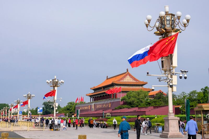 Russian and Chinese national flags flutter in the wind at Tiananmen Gate, in Beijing, May 16, 2024. (Andy Wong/AP)