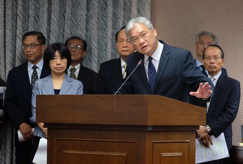 Andrew Hsia gestures while speaking to a lawmaker at the Interior Committee of the Taiwan Parliament on April 13, 2016. Credit: AFP