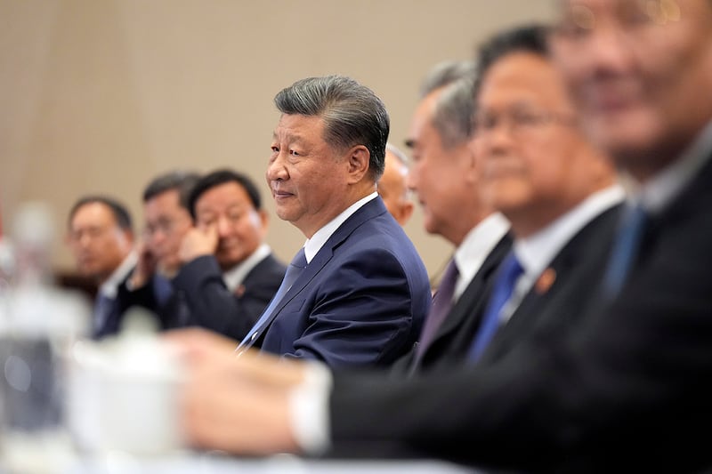 Chinese President Xi Jinping listens as President Joe Biden speaks during a bilateral meeting, Nov. 16, 2024, in Lima, Peru.