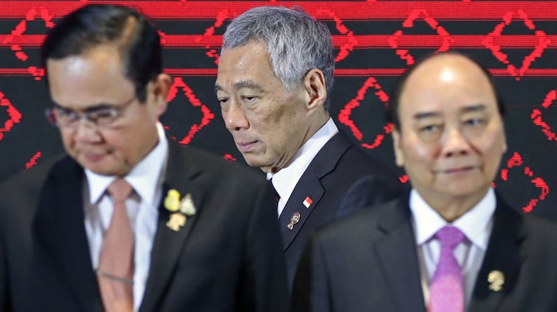 Singapore's Prime Minister Lee Hsien Loong (center) pictured next to the leaders of Thailand and Vietnam at a summit of Southeast Asian leaders in Bangkok, Thailand, in November 2019. 