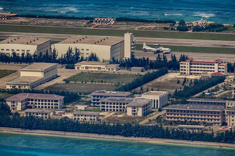 In this Oct. 25, 2022, aerial photo, an aircraft is seen on the tarmac of the artificial island built by China at Mischief Reef in the Spratly Islands, South China Sea. (Photo: Ezra Acayan/Getty Images)