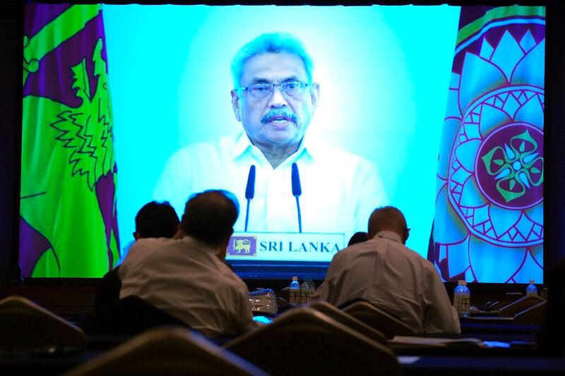 Participants look at Sri Lankan President Gotabaya Rajapaksa's pre-recorded speech shown on a screen at The Future of Asia conference, May 26, 2022 in Tokyo. Credit: AP