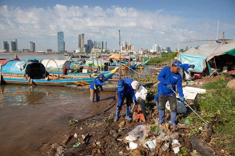 A group from River Ocean Cleanup cleans up trash at the confluence of the Mekong and Tonle Sap rivers in Phnom Penh.