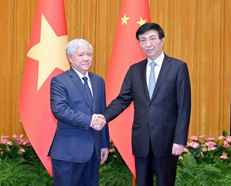 Wang Huning, right, a Chinese Communist Party official, meets with Vietnam's Do Van Chien in Beijing, July 20, 2023. (Yue Yuewei/Xinhua via Getty Images)