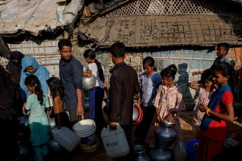 Rohingya line up for drinking water at a Cox’s Bazar refugee camp in Bangladesh, Nov. 22, 2024.