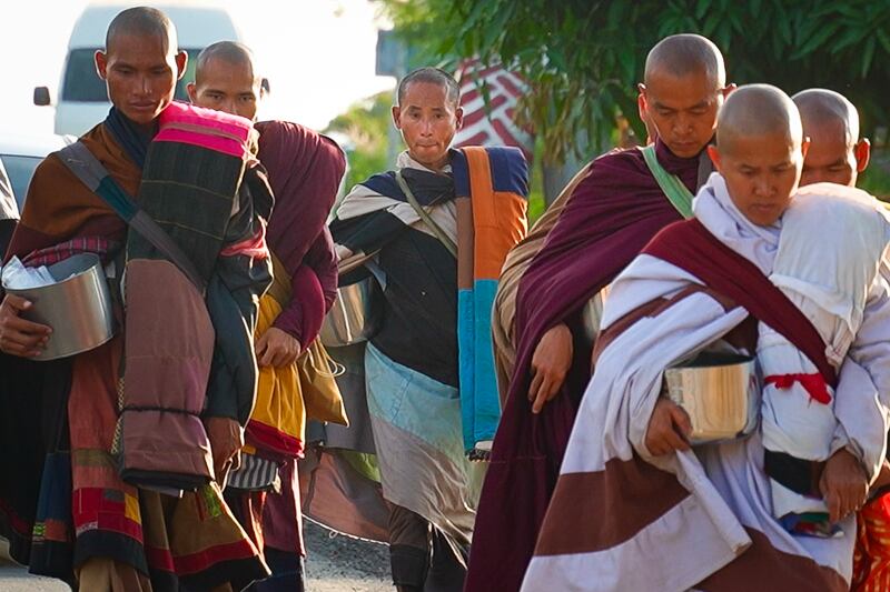 Vietnamese monk Thich Minh Tue, center, walks in Chong Mek, Ubon Ratchathani Province, Thailand, Dec. 31, 2024, as he arrives in Thailand from Laos.