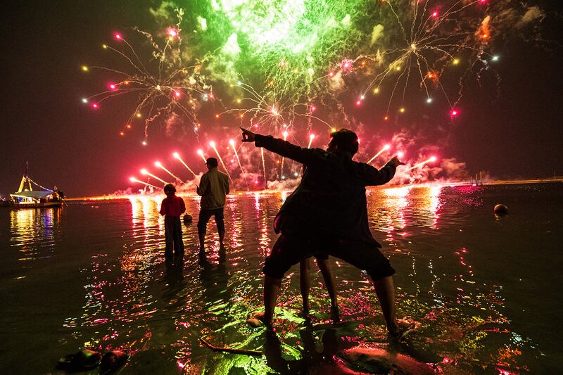 Residents watch fireworks at Ancol Beach in Jakarta on Jan. 1, 2025.