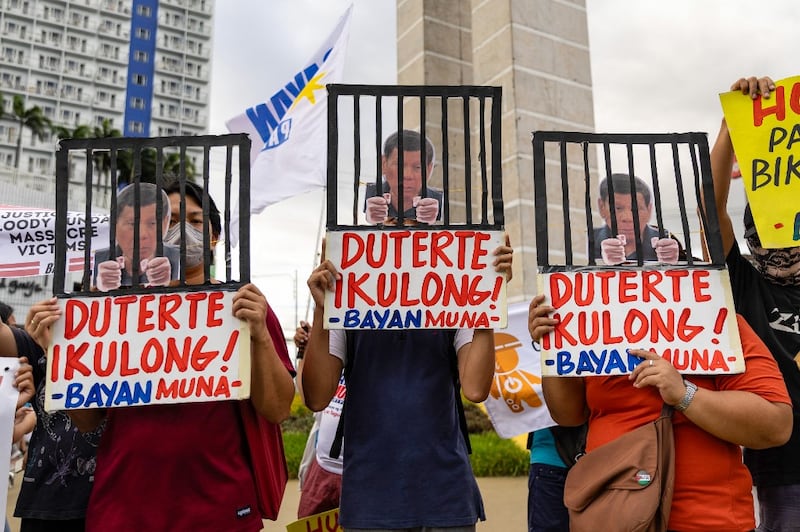 Protesters demonstrate demanding justice for drug war victims, after the arrest of former Philippine president Rodrigo Duterte, in Quezon City on March 11, 2025. (Photo by Earvin Perias / AFP)