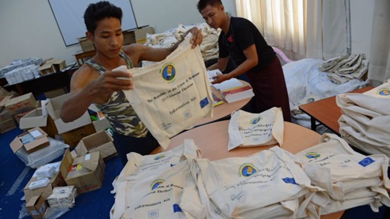 Workers prepare election paraphernalia at Myanmar's Union Election Commission headquarters in Naypyidaw, Oct. 27, 2015, in preparation for Nov. 8 general elections. 