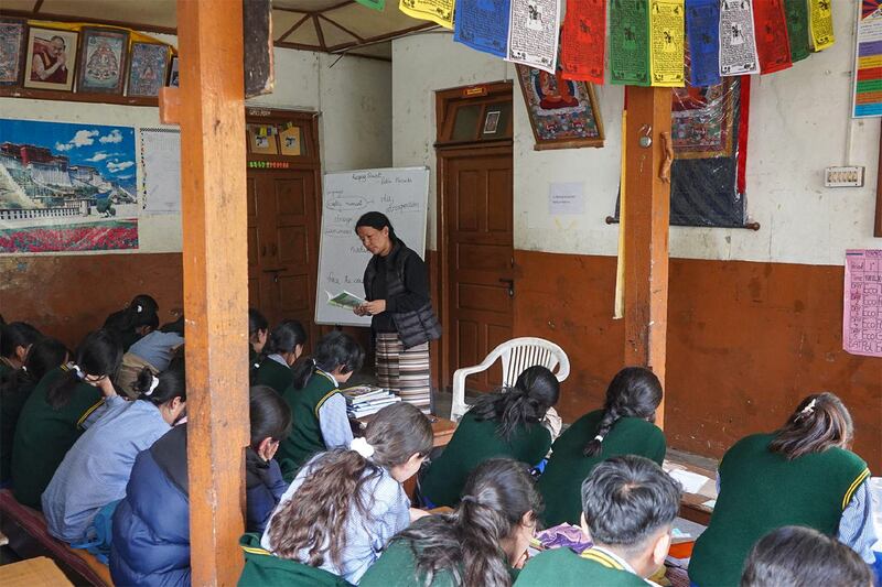 Tsetan Dolkar teaches an 11th grade English class at the Tibetan Children’s Village school in Dharamsala, India, Nov. 11, 2024.