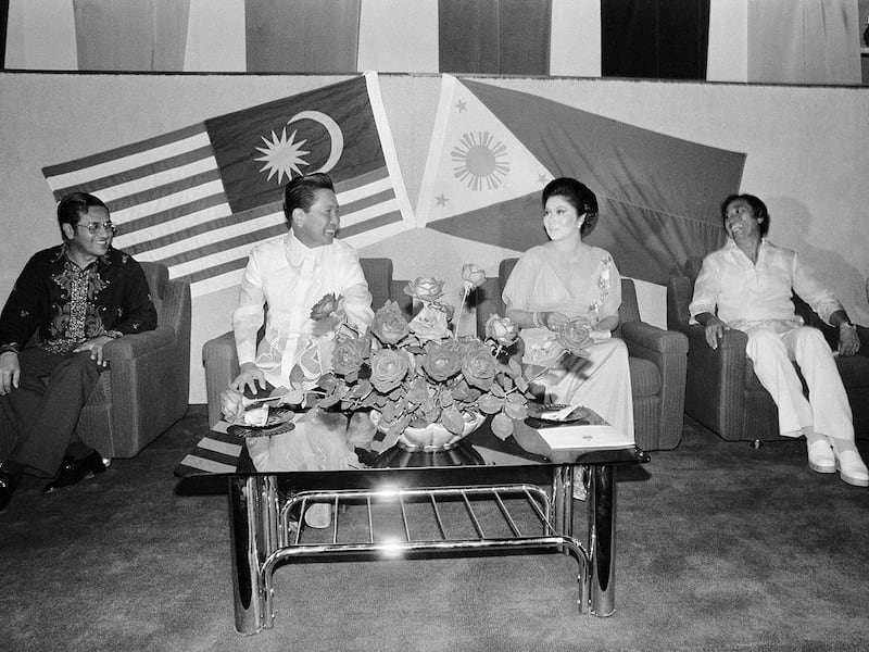 Philippine President and Mrs. Ferdinand E. Marcos, center, meet with Malaysia Deputy Prime Minister Mahathir Mohamad, left, and Sabah's Chief Minister Harris Salleh, right, on August 9, 1977, in Labuan, Eastern Malaysia.