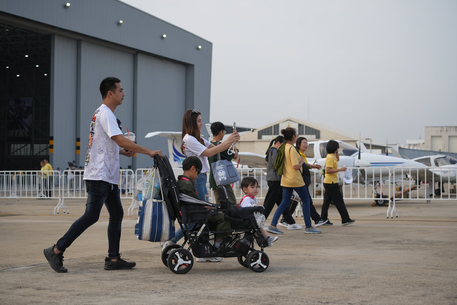 Spectators arrive at Don Mueang air base for the international air show commemorating the 88th anniversary of the Royal Thai Air Force, Mar. 7, 2025, in Bangkok.
