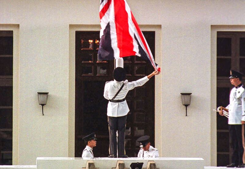 The British flag is lowered at Hong Kong's Government House for the last time during farewell ceremonies for Gov. General Chris Patten. (Associated Press)