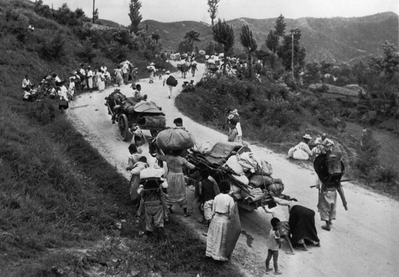 North Korea's surprise offensive drove defenders and fleeing civilians behind a defensive line in a small area known as the “Busan Perimeter.” Pictured: South Korean civilians walk on a road leading south in Aug. 1950. Credit: AP