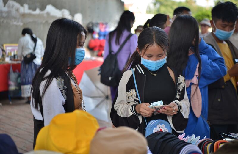 Women shop at a stall in Vientiane, Laos, Jan. 9, 2023. Inflation in Laos increased to 39.3 percent year-on-year in December, the highest rate of 2022, according to Lao Statistics Bureau. (Tamon Huengmeexay/Xinhua via Getty Images)